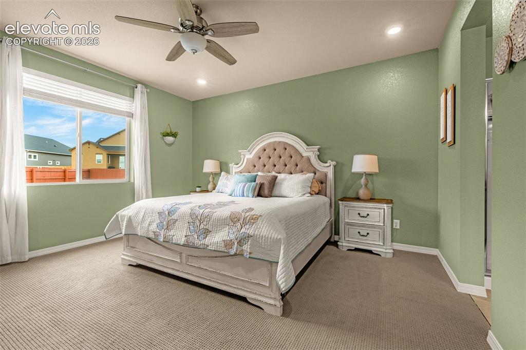 Image 17 of 40: Ceiling fan with integrated lighting, recessed lighting, and wall-to-wall c