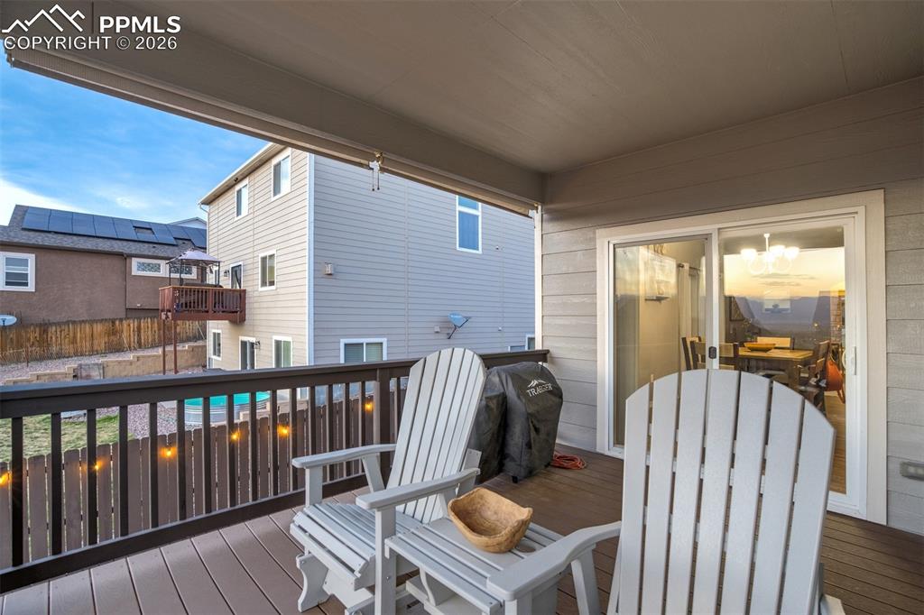 Image 13 of 46: Covered Deck - Enjoy morning coffe or evening sunsets