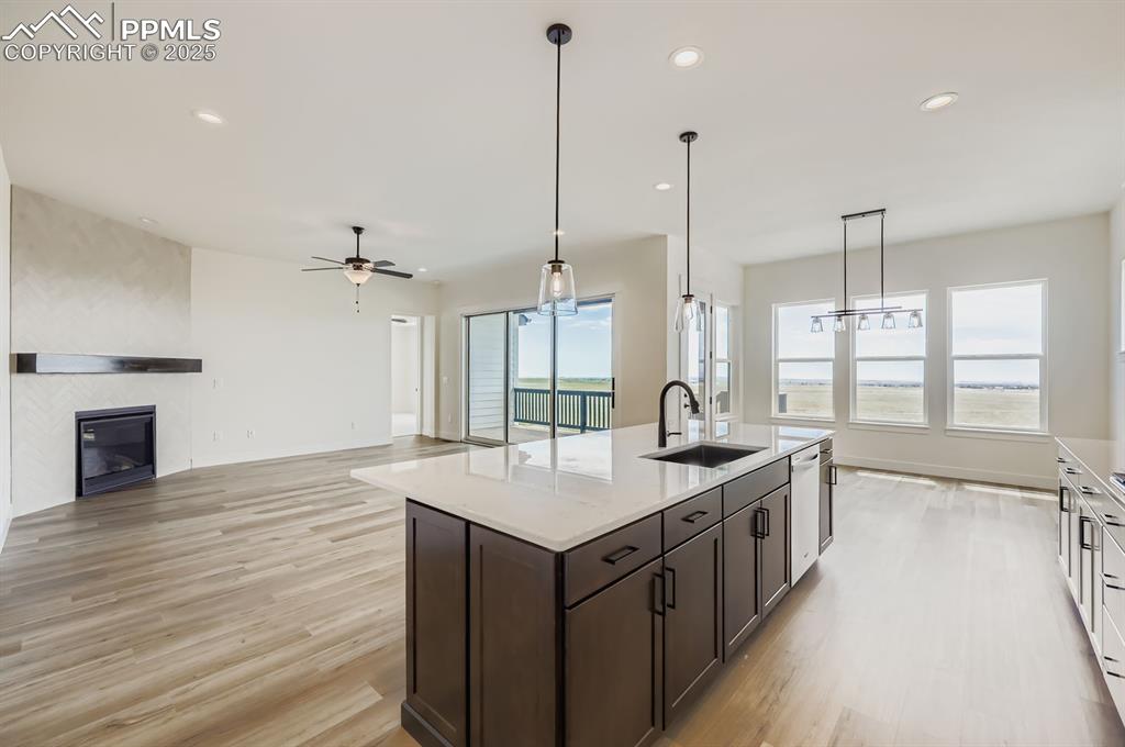 Image 11 of 29: Kitchen featuring recessed lighting, light wood-style floors, light counter