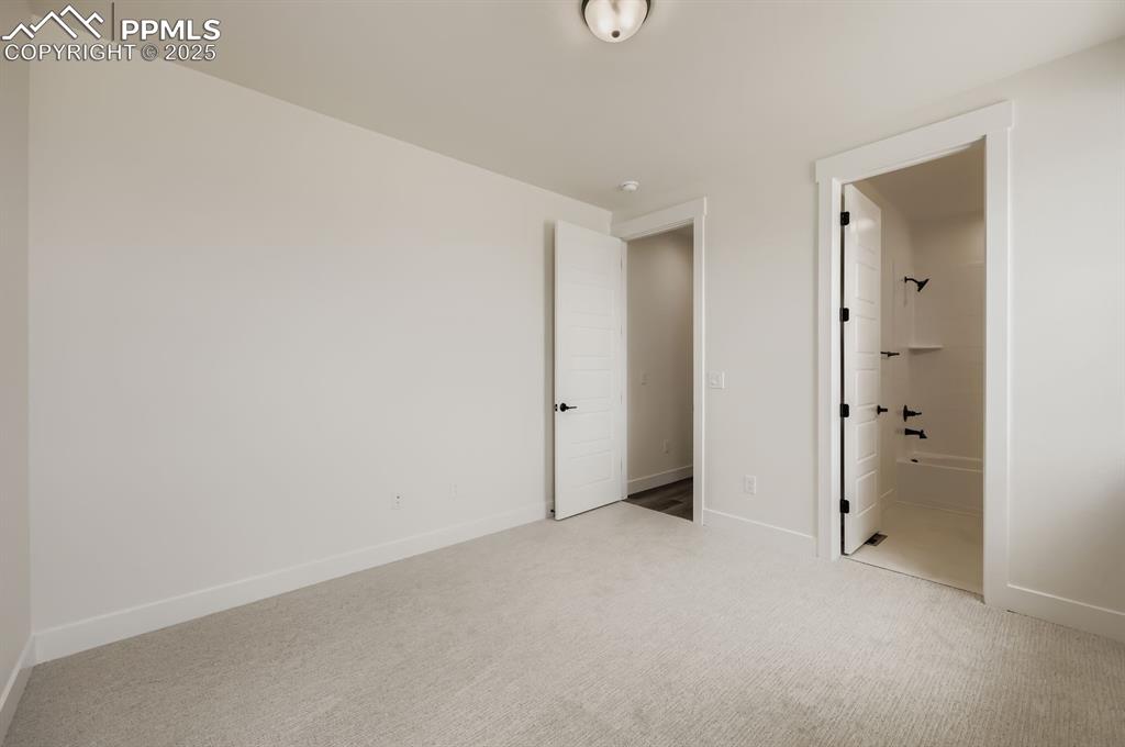Image 19 of 29: Unfurnished bedroom featuring carpet floors and baseboards