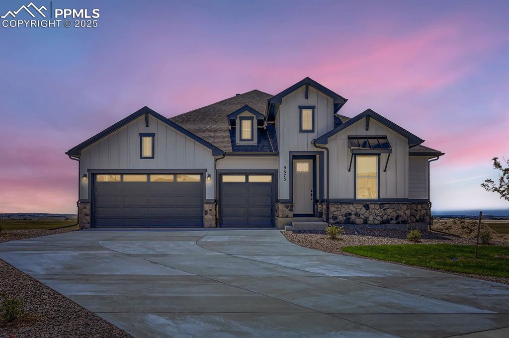 Image 2 of 29: Modern farmhouse style home featuring board and batten siding, a shingled r