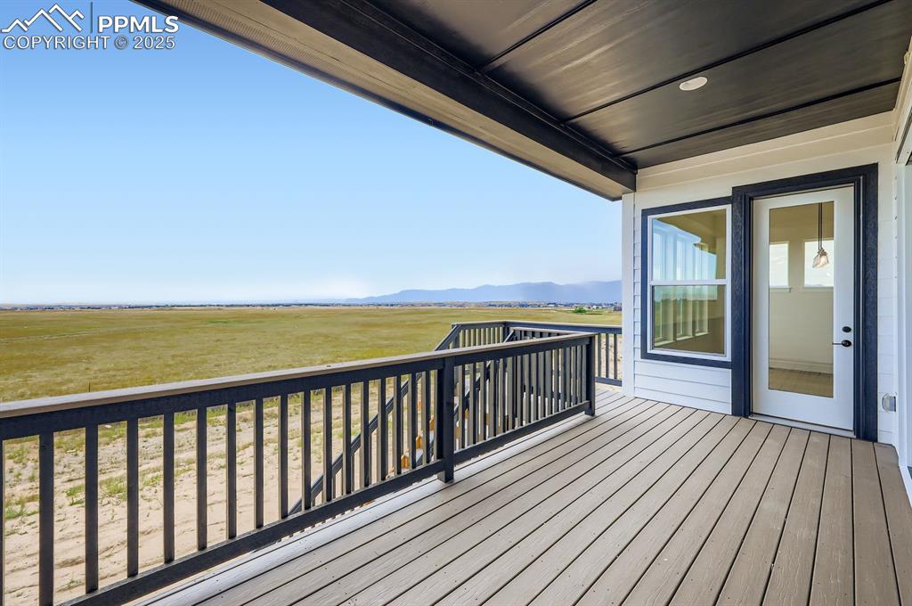 Image 27 of 29: Wooden terrace with a mountain view and a view of countryside