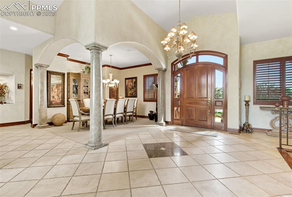 Image 12 of 50: The entry foyer can accommodate a grand piano. 