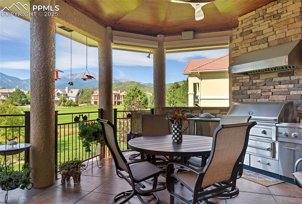 Image 46 of 50: The outdoor kitchen is complete with a Viking grill, warming drawer and ref