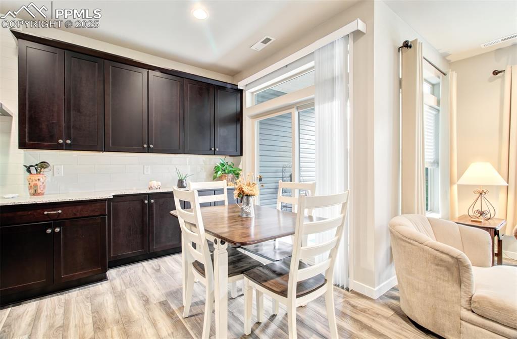 Image 14 of 39: Dining area with walk out to patio.