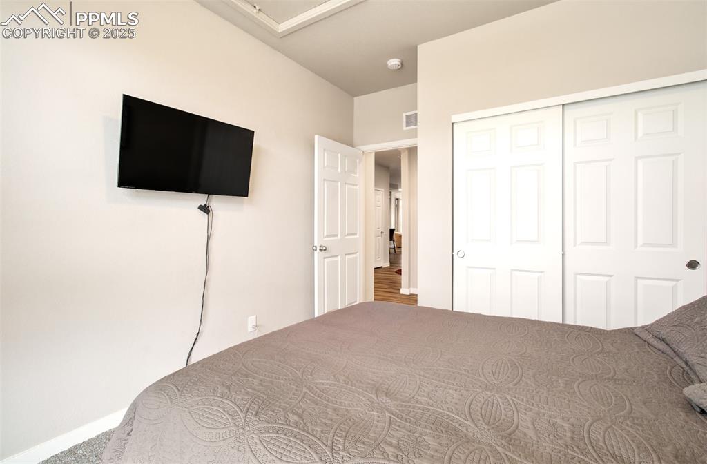 Image 6 of 39: Bedroom featuring baseboards and a closet