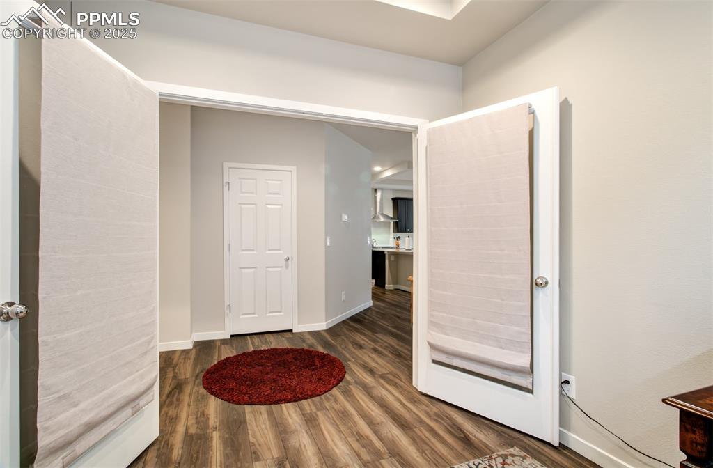 Image 7 of 39: Nice room for the home office, or dining room.