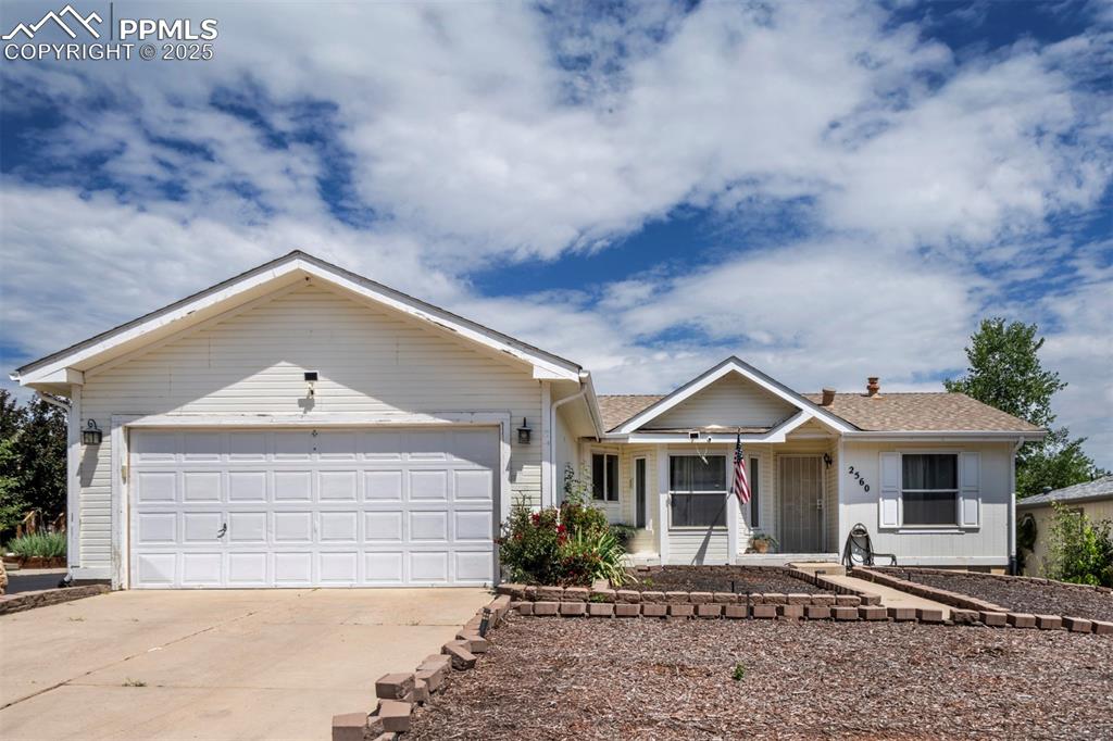 Image 3 of 31: Ranch-style home with concrete driveway, a garage, covered porch, and roof