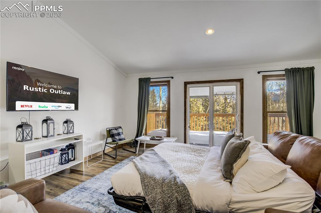 Image 8 of 42: Living room showing the pull out sofa