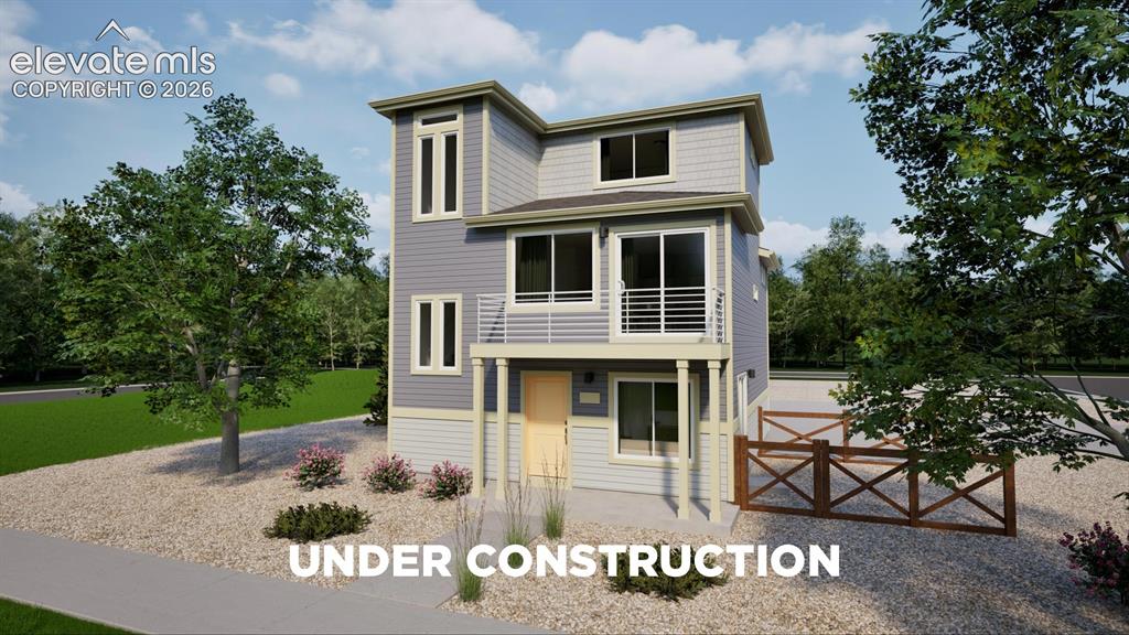 Caption: Modern three-story residence featuring light gray siding and white trim