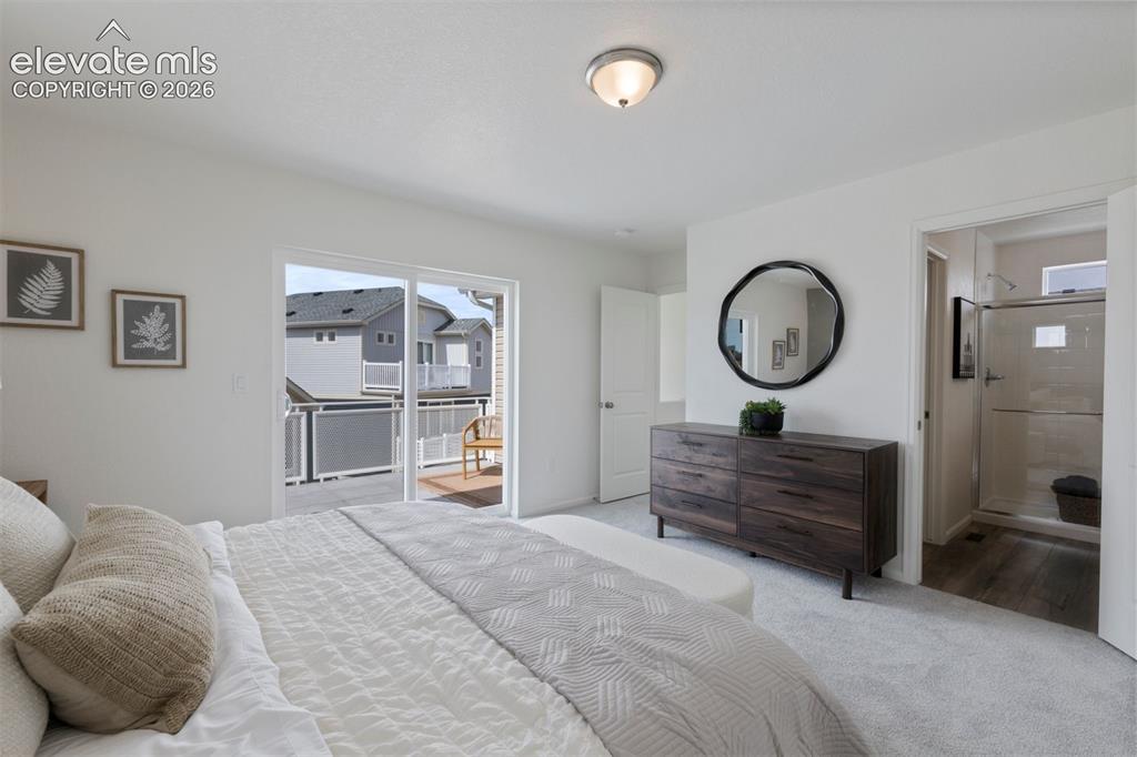 Image 12 of 20: Bedroom featuring a sliding glass door to a private deck
*Photos of a mode