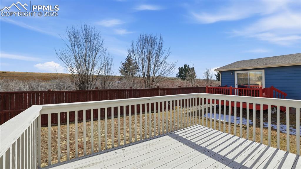 Image 10 of 37: Backyard deck for outdoor dining and relaxation.