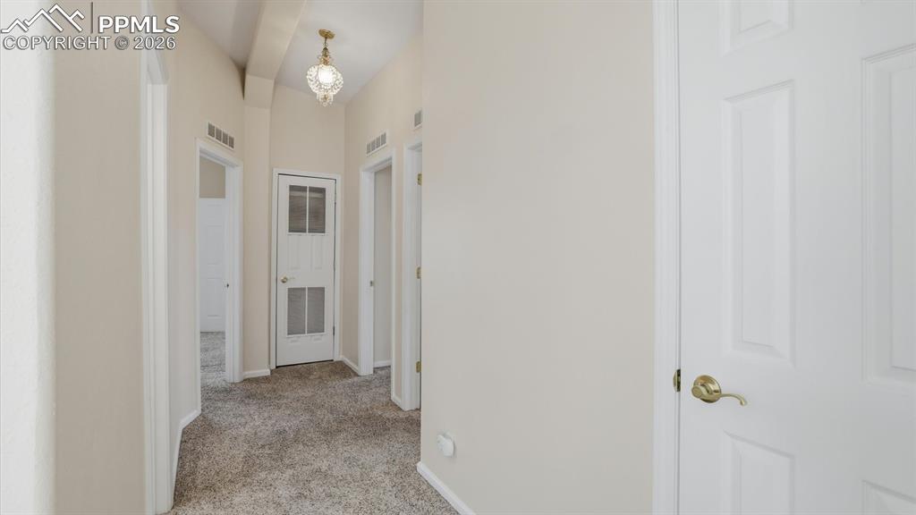 Image 15 of 37: Hallway into the Bedrooms and Bathrooms.