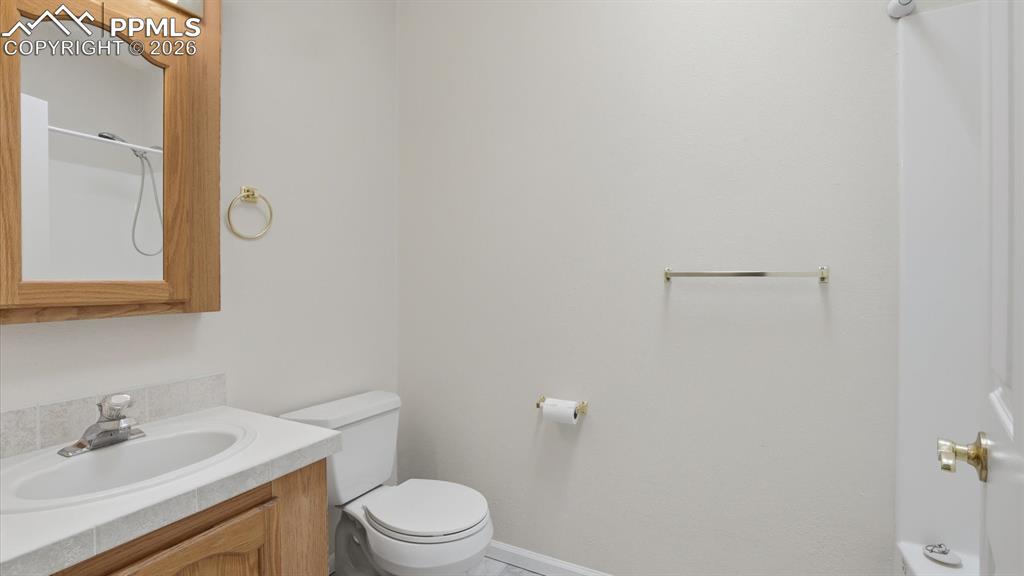 Image 18 of 37: Full Bathroom with vanity, framed mirror, and tub/shower.