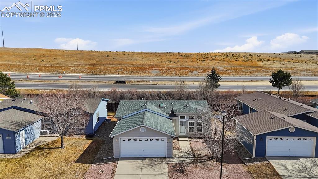 Image 2 of 37: Aerial front view of home with no homes behind.