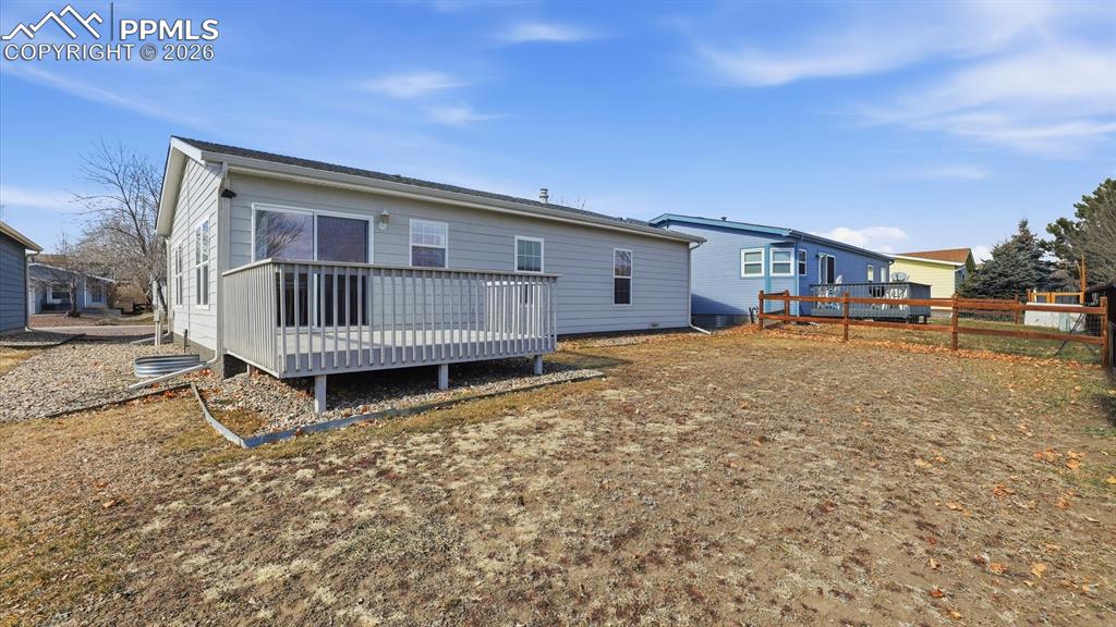 Image 33 of 37: Spacious, level backyard for the kids and pets to play and have fun.