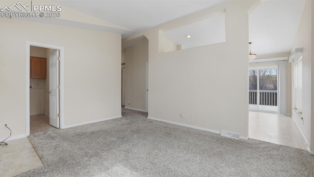 Image 4 of 37: View of the Laundry Room, hallway to bedrooms and bathroom, and Kitchen/Din