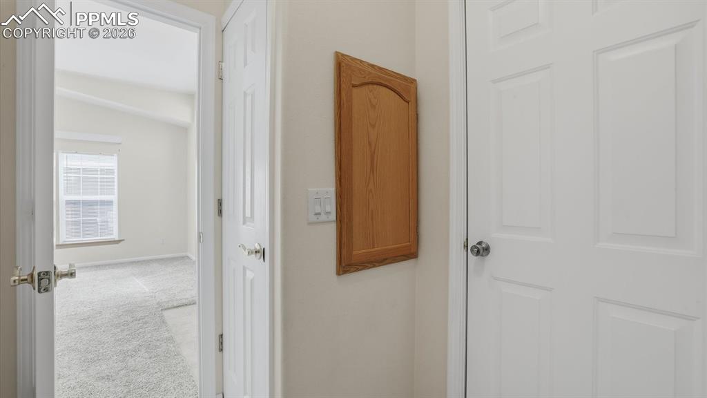 Image 6 of 37: View of the Living Room from the Laundry Room.