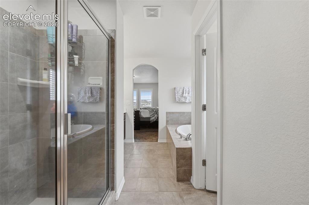 Image 22 of 42: Spacious walk in shower
