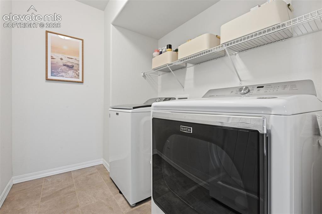 Image 25 of 42: Large laundry room on the upper level