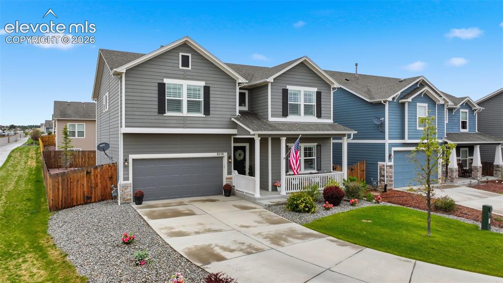 Image 3 of 42: 2 car garage and spacious driveway