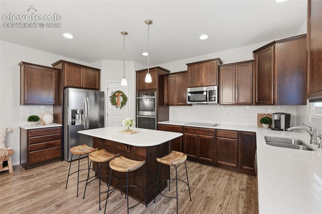 Image 6 of 42: Beautiful kitchen with wood cabinets