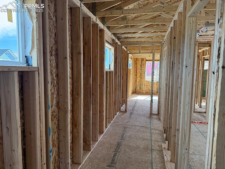 Image 13 of 20: Upper level hallway. Please, excuse our dust as this home is currently unde