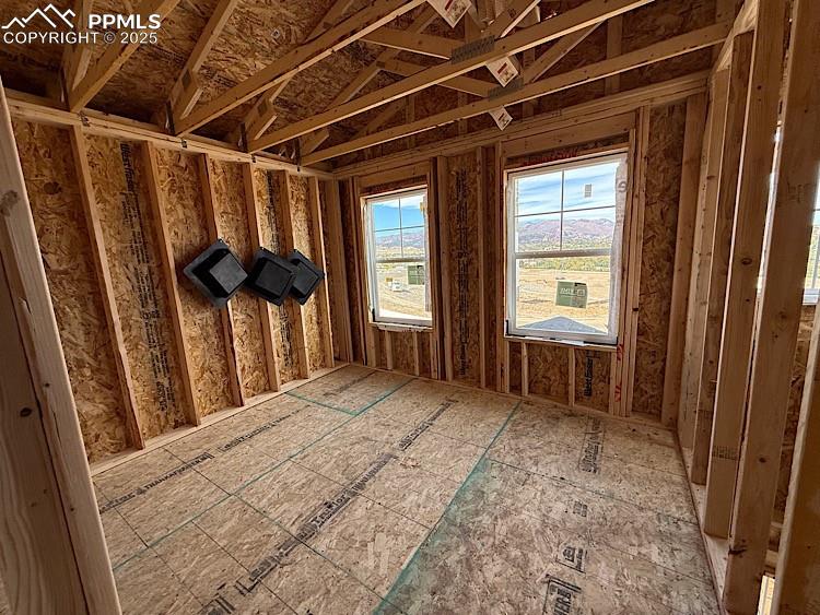 Image 19 of 20: Bedroom 3 located on the upper level. Please, excuse our dust as this home