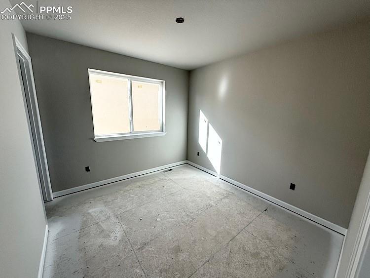 Image 23 of 36: Bedroom 2 located on the upper level.  Please, excuse our dust as this home