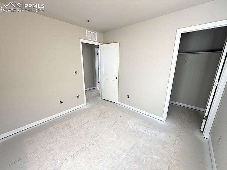 Image 24 of 36: Bedroom 2 located on the upper level.  Please, excuse our dust as this home