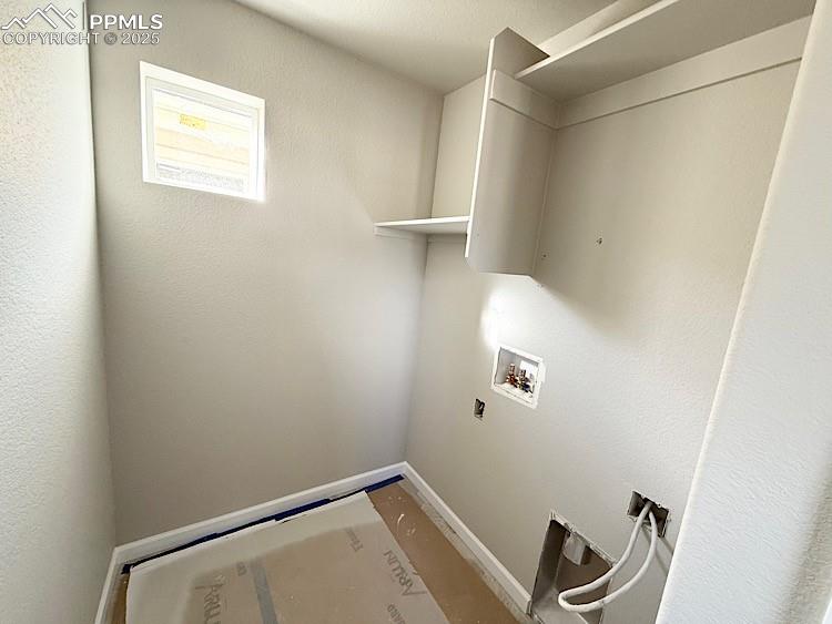 Image 26 of 36: Laundry Room located on the upper level. Please, excuse our dust as this ho