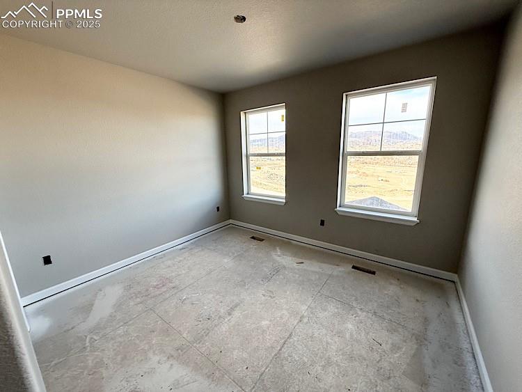 Image 29 of 36: Bedroom 3 located on the upper level.  Please, excuse our dust as this home