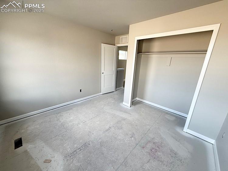 Image 30 of 36: Bedroom 3 located on the upper level.  Please, excuse our dust as this home
