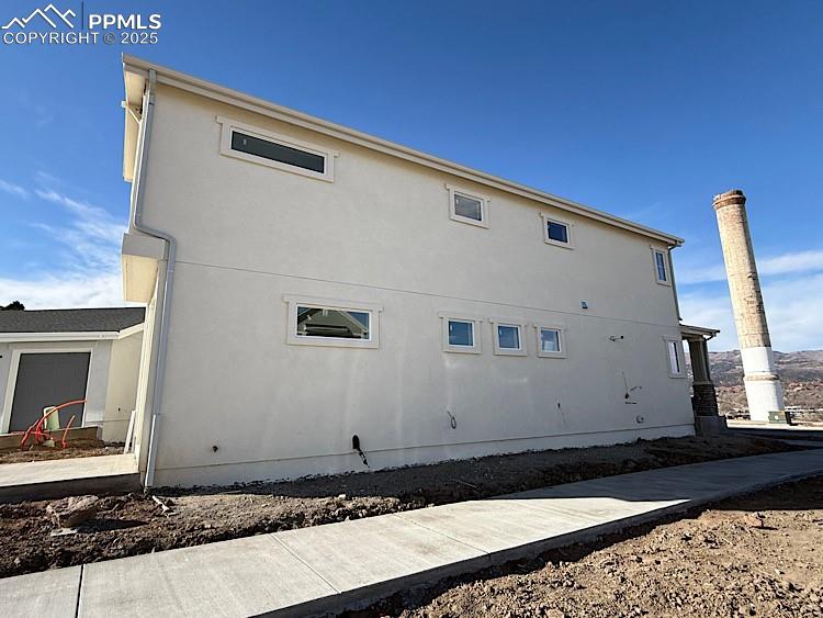 Image 34 of 36: Side of Structure. This home sits on a corner lot! Please, excuse our dust 