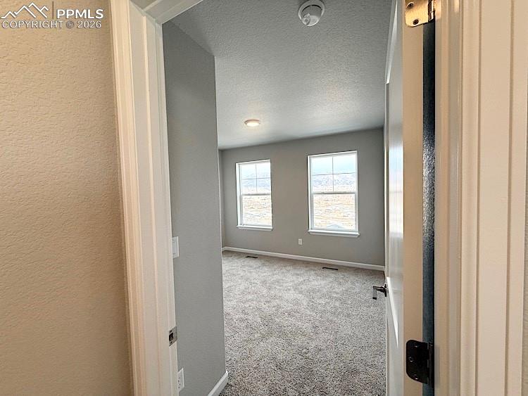 Image 38 of 48: Bedroom 3 located on the upper level. Please, excuse our dust as this home
