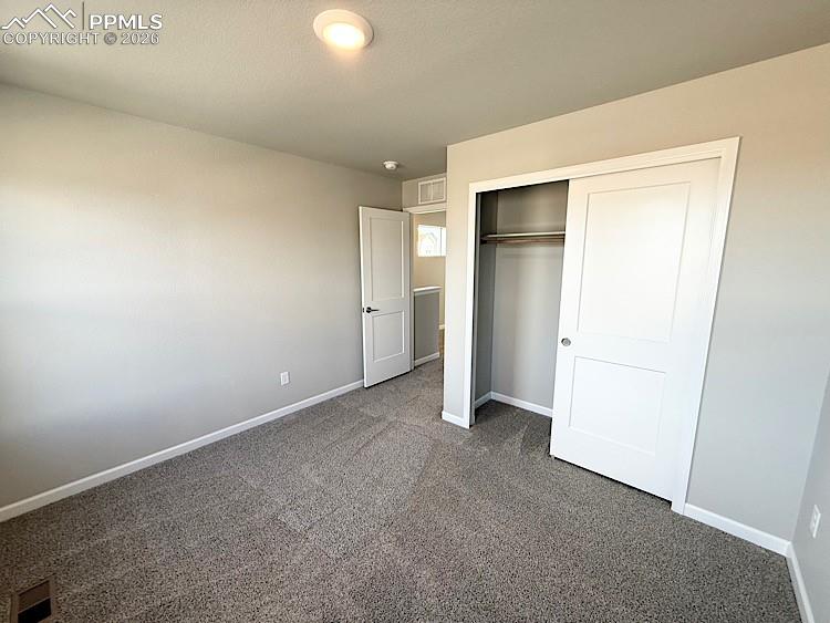 Image 41 of 48: Bedroom 3 located on the upper level. Please, excuse our dust as this home