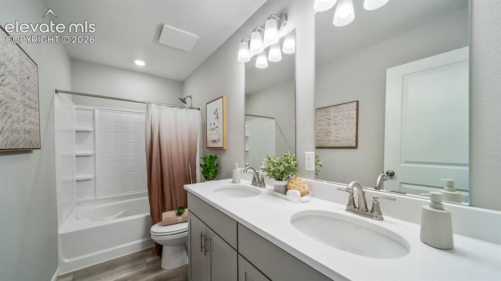 Image 2 of 39: Double vanity with integrated sinks and brushed nickel faucets
Photos of a