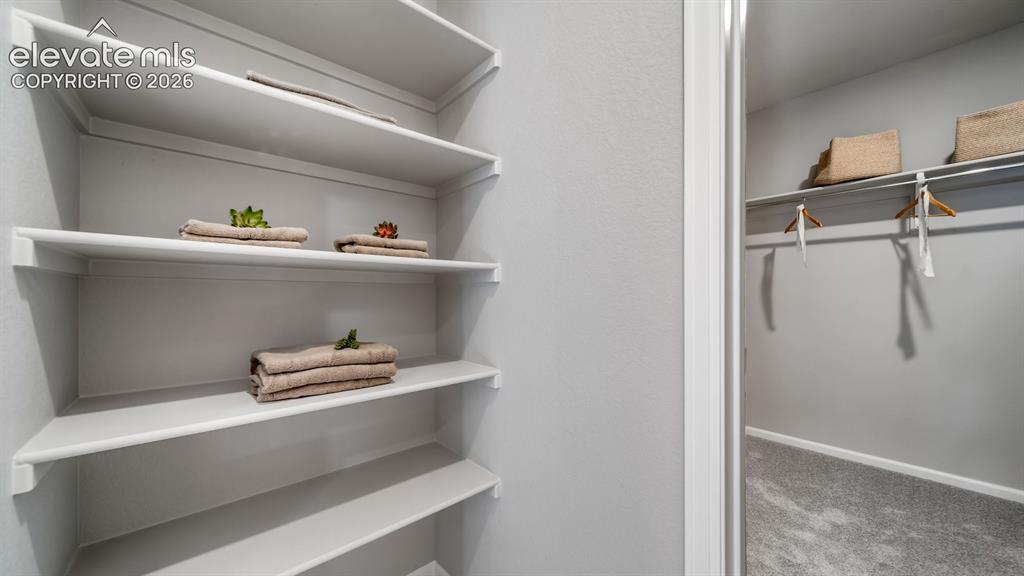 Image 31 of 39: Built-in shelving system with white finishes
Photos of a model home
