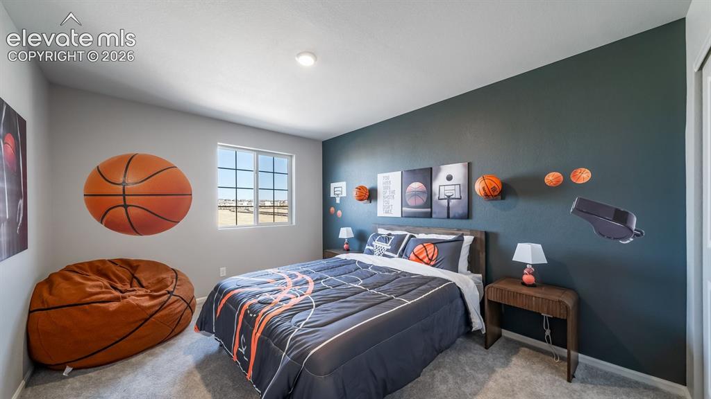 Image 6 of 39: Bedroom featuring a multi-pane window, recessed lighting, and soft carpet f