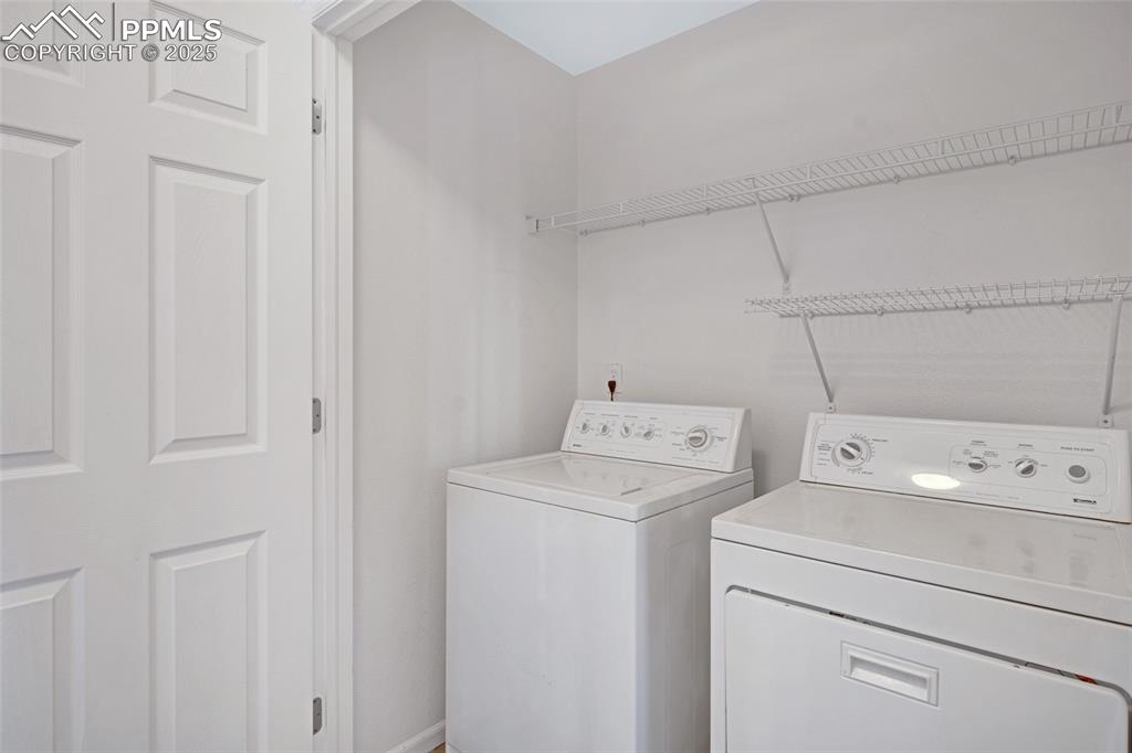 Image 20 of 24: Washroom featuring independent washer and dryer