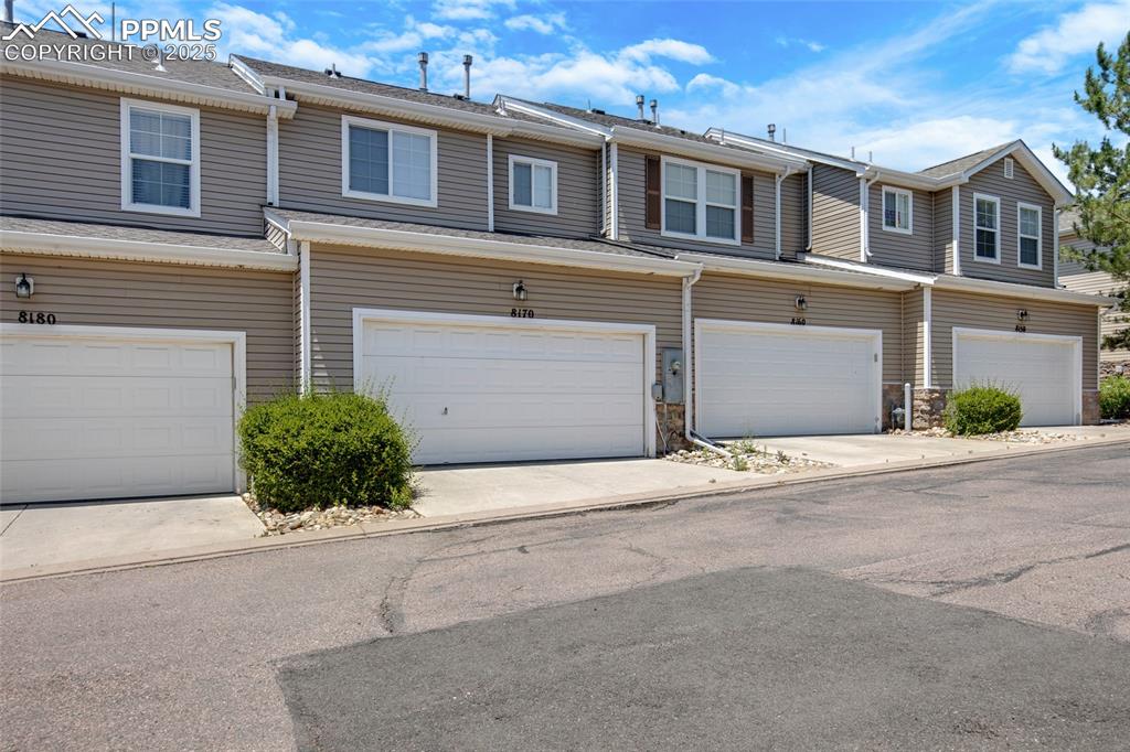 Image 24 of 24: Multi unit property featuring a garage