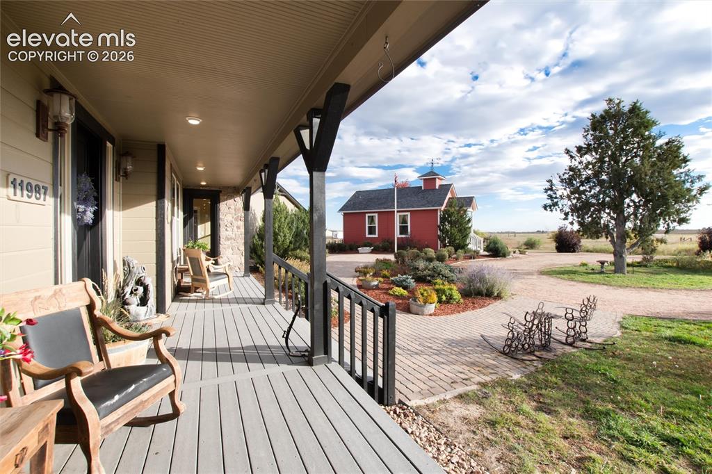 Image 11 of 44: Front entry to enjoy watching sunsets over Pikes Peak