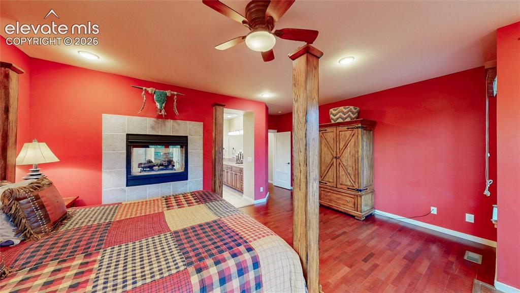 Image 27 of 44: Main floor primary bedroom with attached ensuite.