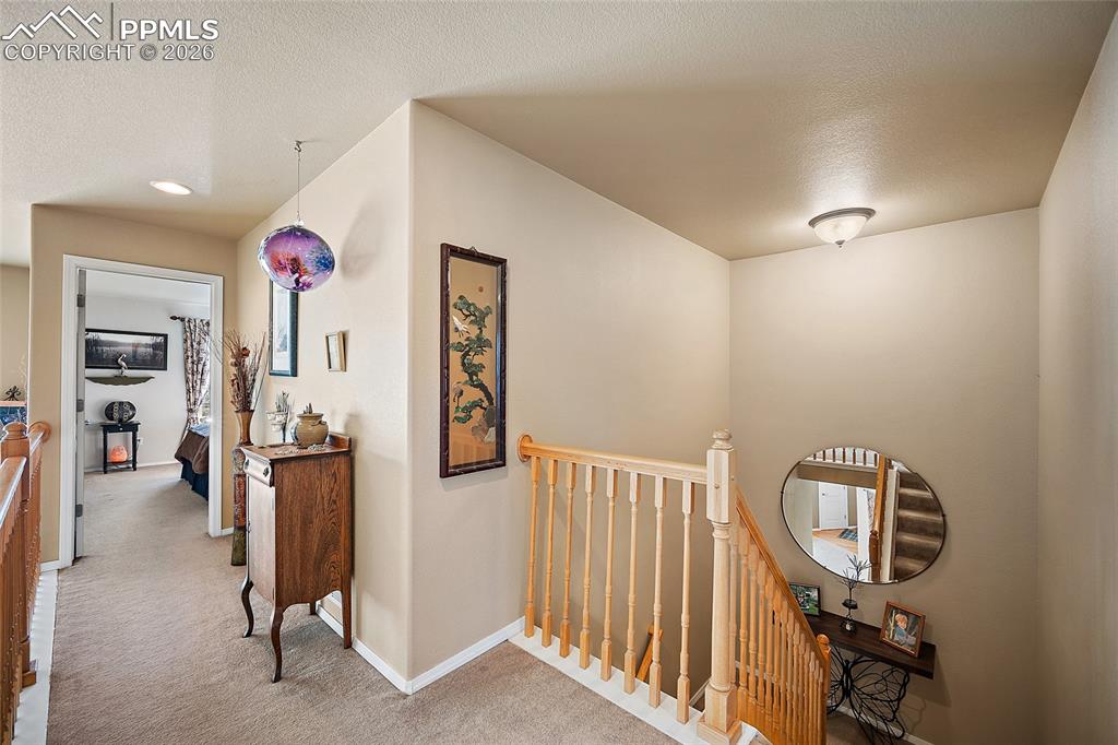 Image 20 of 49: Upper-level hallway.  