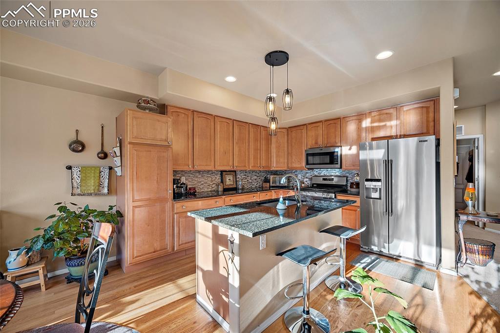 Image 9 of 49: Upgraded Stainless steel appliances and gas oven. 