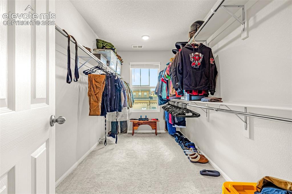 Image 21 of 35: Walk-In Closet in Master Bedroom