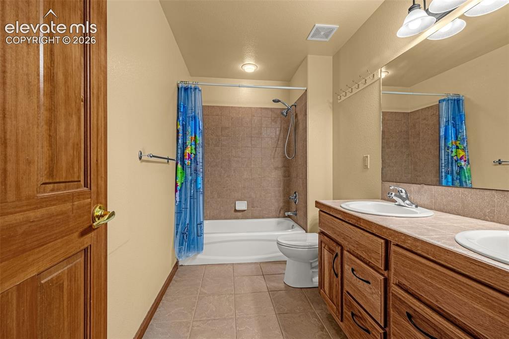 Image 26 of 43: Upstairs full hall bath
