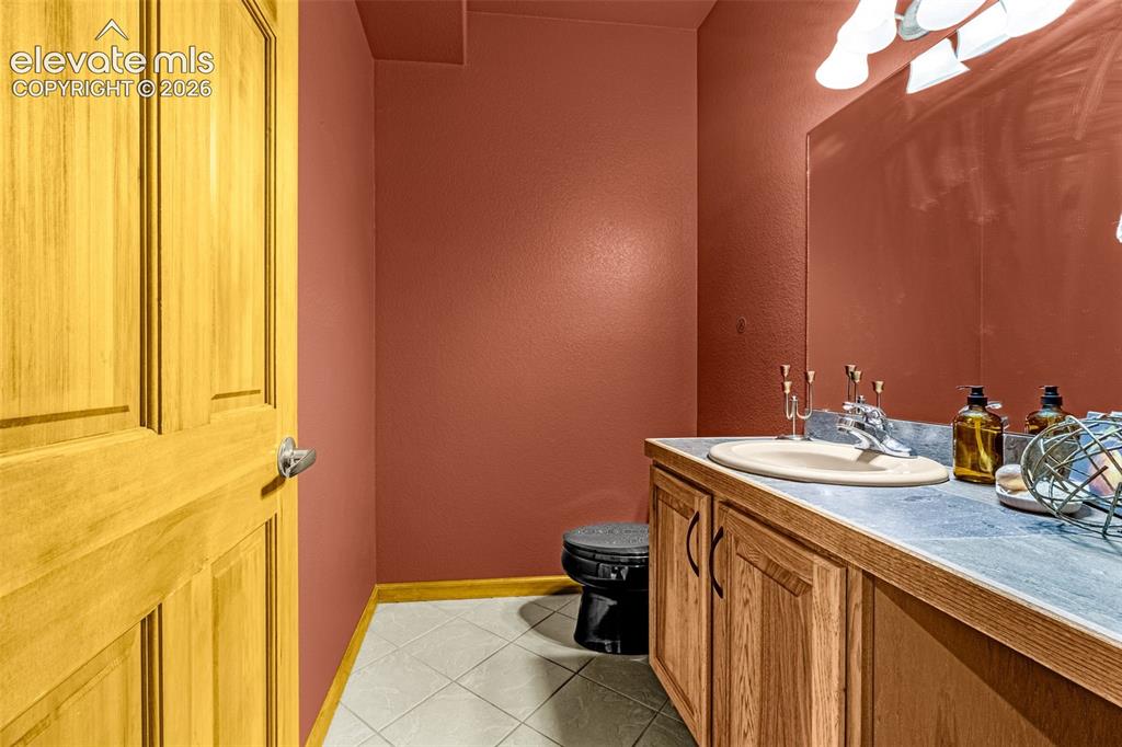 Image 40 of 43: Main level half bath