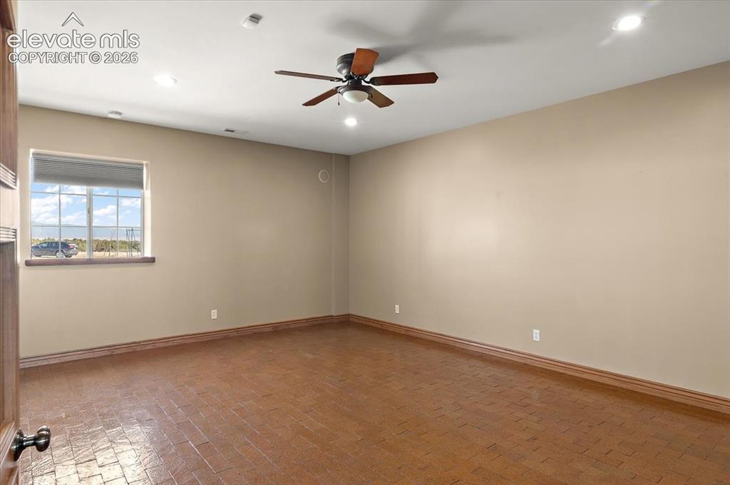 Image 11 of 50: 14 ft. X 20 ft. second bdrm. has 2 inwall speakers and ceiling fan