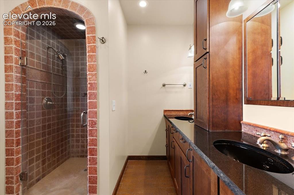 Image 19 of 50: Double vanity and shower in 5 piece primary bath.